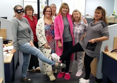 employees in the office dressed in pajamas