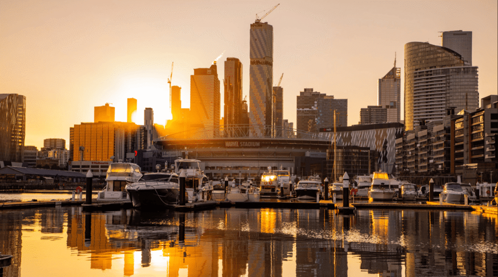melbourne docklands harbour overlooking marvel stadium at sunset